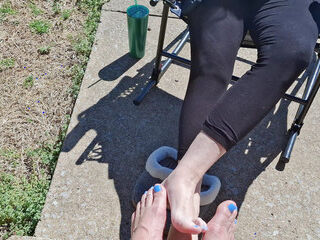 Showing off our pedicure toes while playing footsie in public