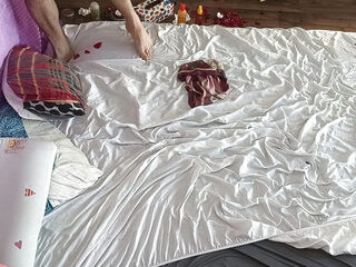 Foreplay in the bedroom with an amateur couple.