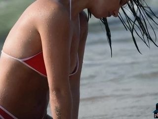 German wifey model Joelina takes off nude on the beach