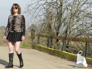 Patricia undresses on the outdoor bridge