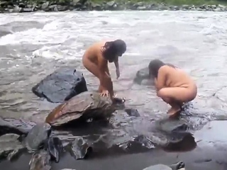 ï»¿2 indian mature womens bathing in sea bare