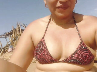 Big ass brunette Latina is very horny and ends up masturbating on the beach, sand and sun